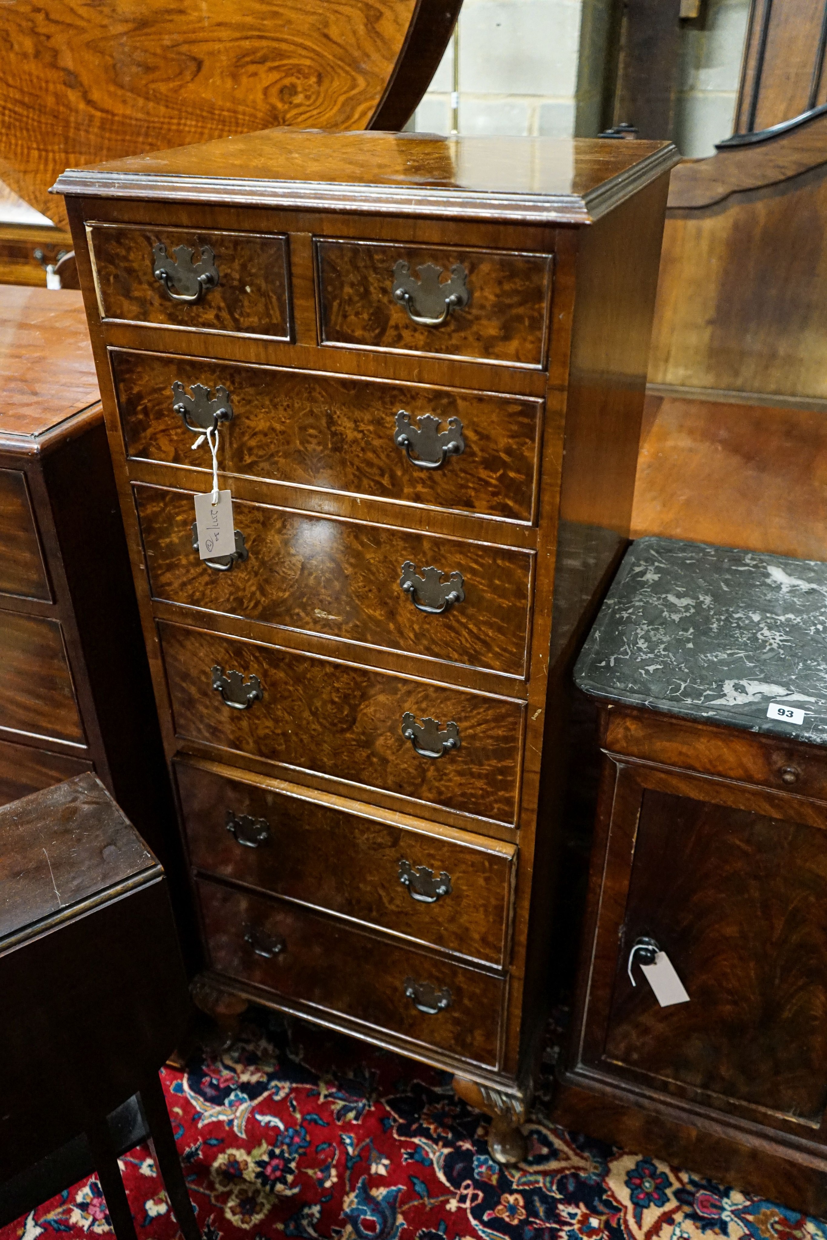 An Edwardian mahogany Sutherland table, width 61cm together with a Queen Anne style figured walnut narrow seven drawer chest